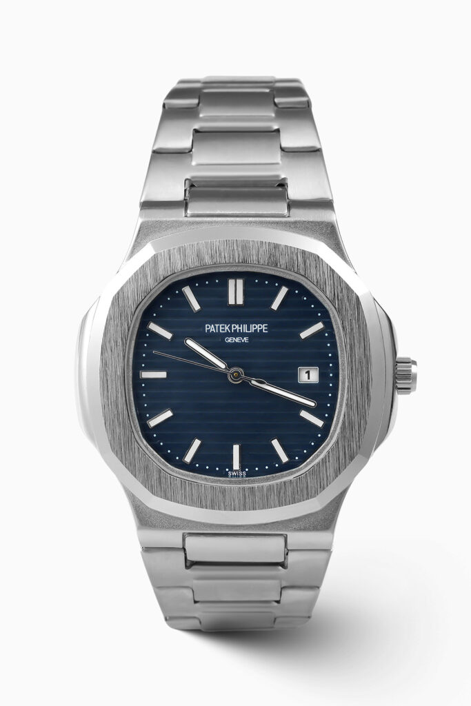 Patek Philippe blue dial steel inspired luxury watch featuring elegant design and stainless steel bracelet.