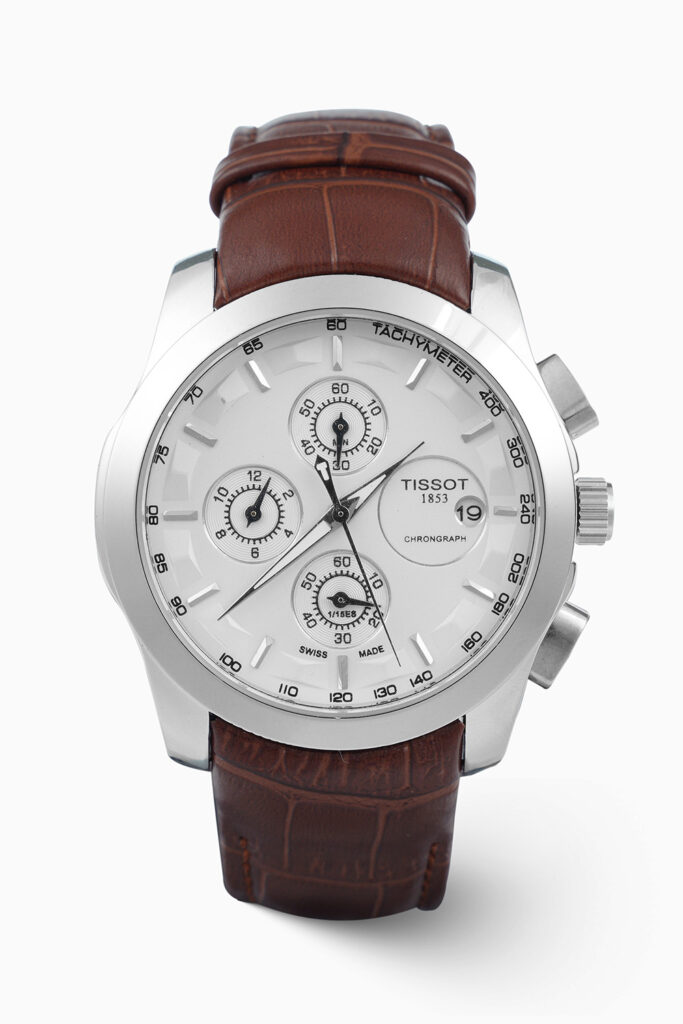 Tissot Chronograph Classic inspired quartz watch with white dial, three subdials, and brown leather strap.